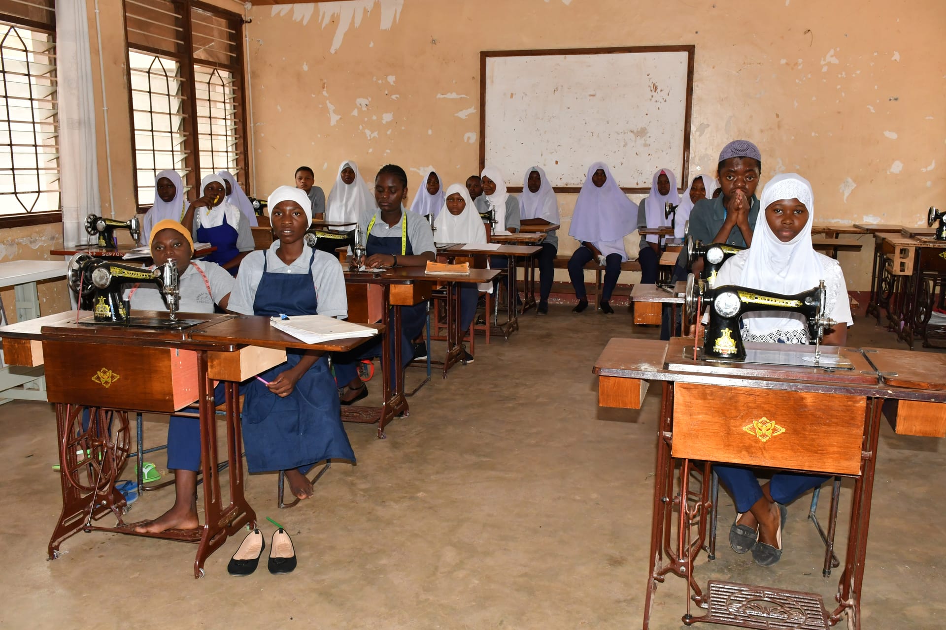 Young women engaged in classroom learning at a Folk Development College